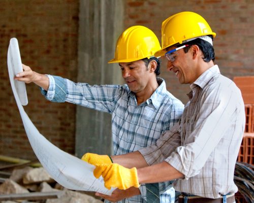 home builder experts checking the blueprint